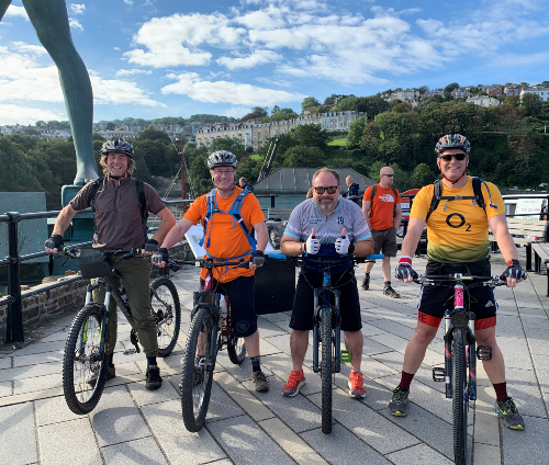 A picture of Jeremy and friends, along with their bicycles at a cycle sport event