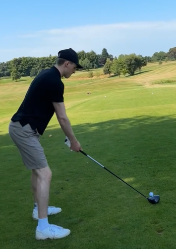 A picture of Thomas playing golf