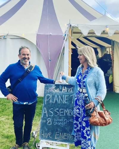 Zoe along with Guy Ledger, with a tent in the background the Hay Festival .