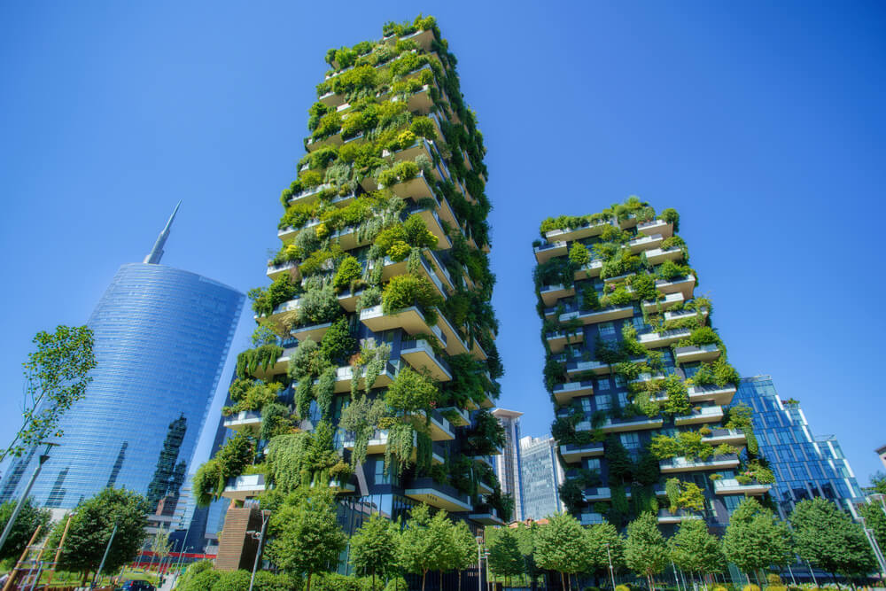 skyscrapers covered in green plants