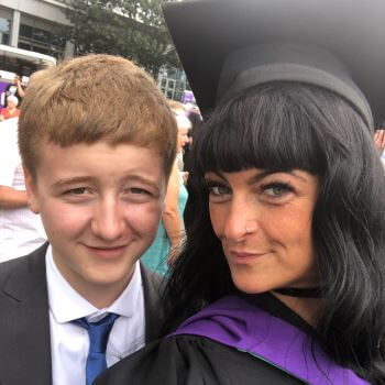 image of Nicole at her law graduation with her son