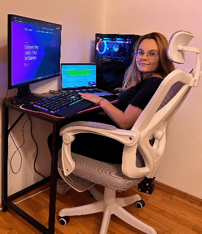 Photo of Karla at her workstation at home
