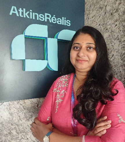 Photo of Mahalakshmi with the AtkinsRéalis logo