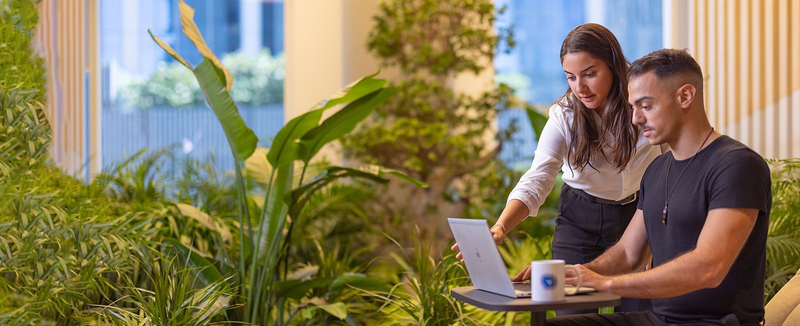 Man and women working on laptop