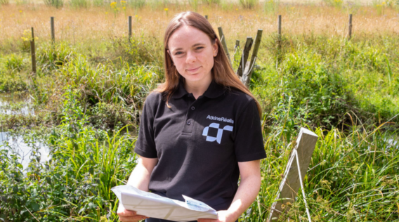 a girl wearing atkinsrealis print tshirt.