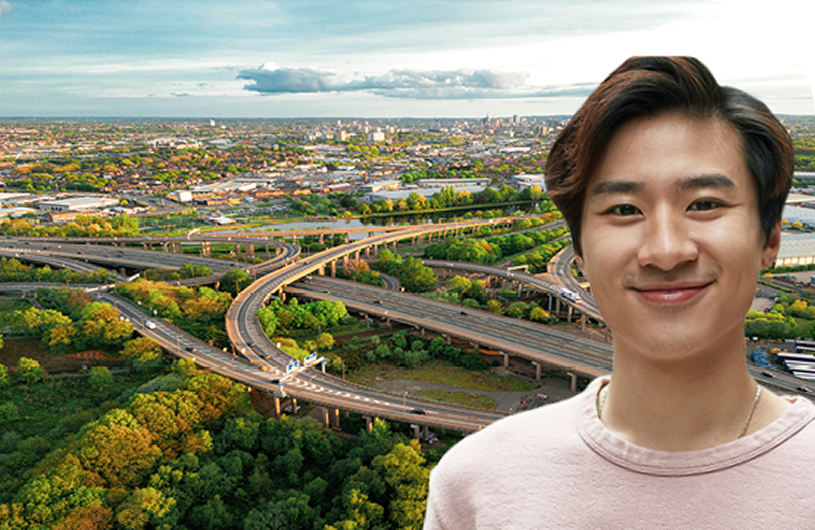 a man smiling and flyovers in background