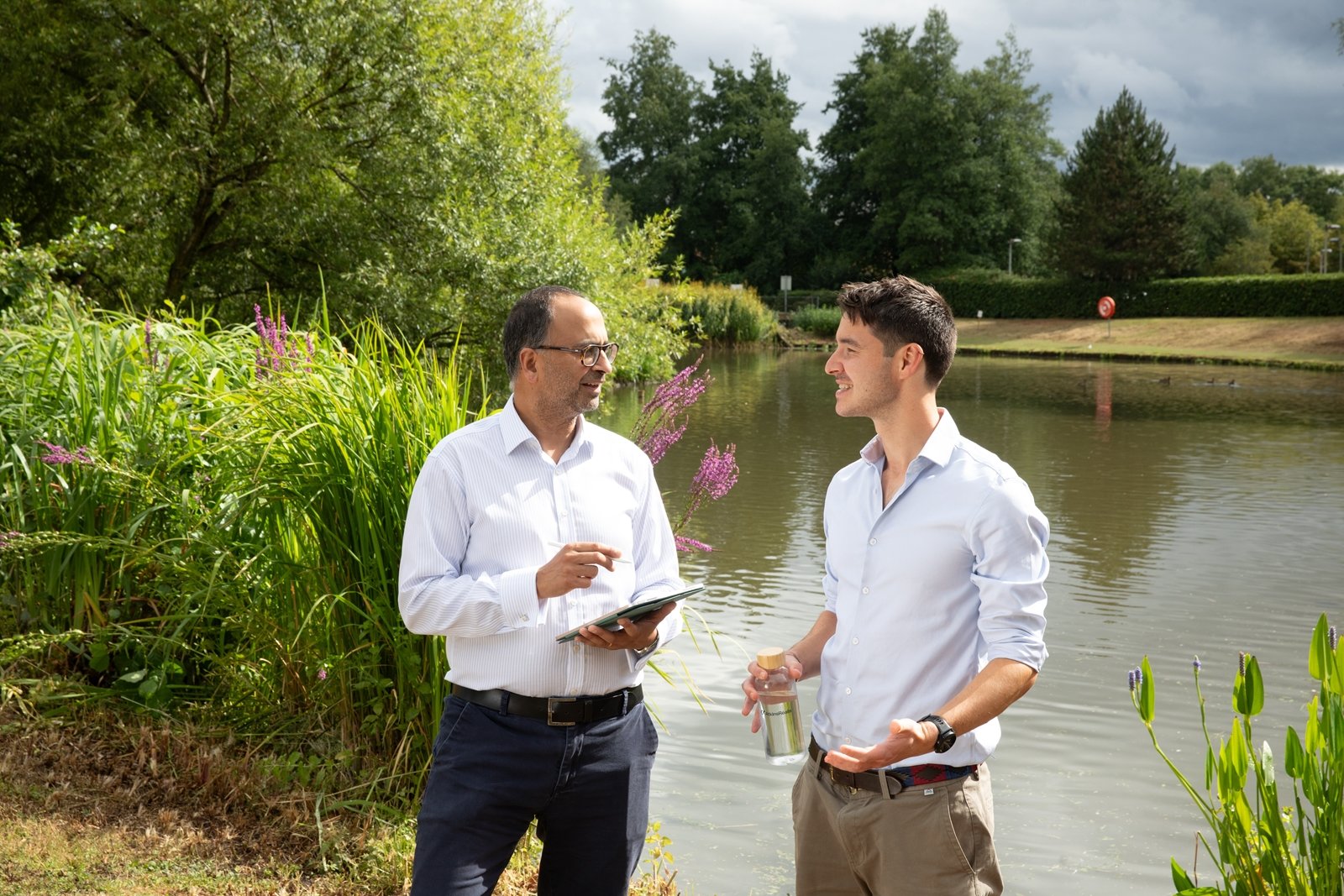 Environmental engineer conducting field study in meadow