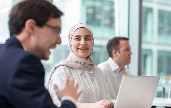 people discussing with laptop