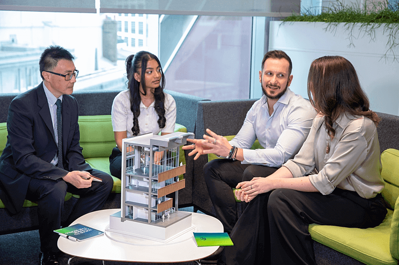 team sitting around lunch table