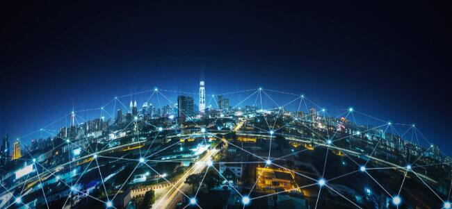 Connected smart city skyline at night