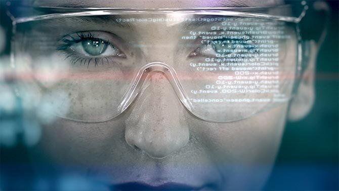 Woman wearing smart glasses with digital code reflection