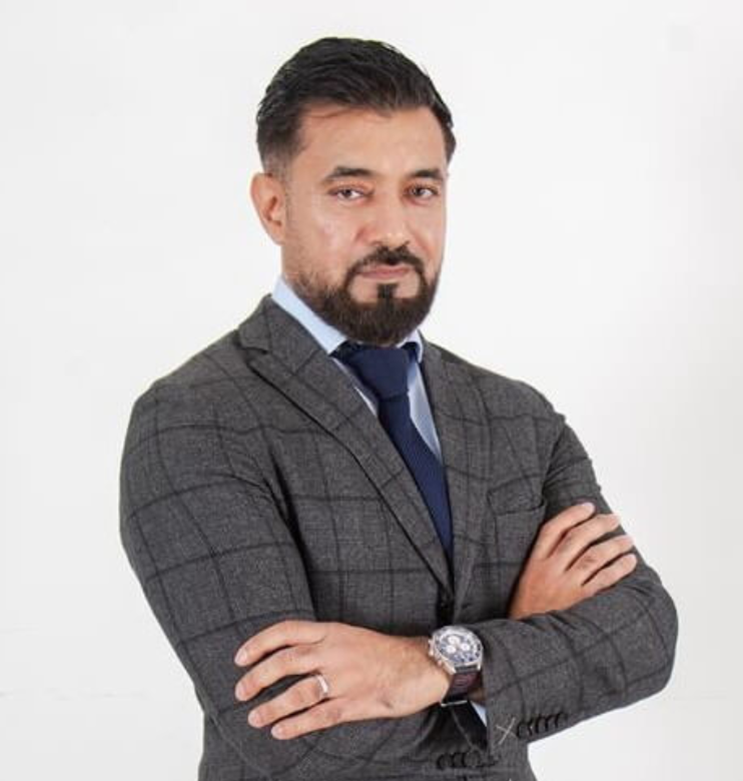 man wearing suits and folding his hands.