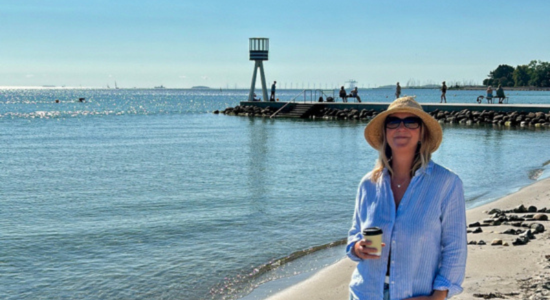 Picture of Jo standing by a beach