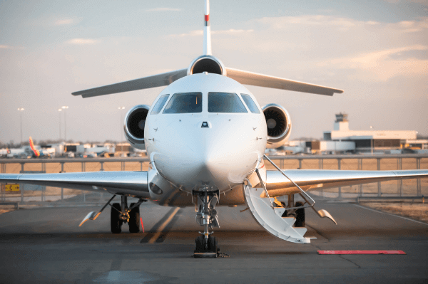 Private jet parked at airport terminal