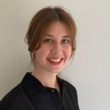 Photo of Rebecca smiling towards the camera