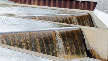 water flowing over two steps in a weir