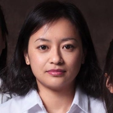 Portrait of a woman with medium-length dark hair and neutral expression.