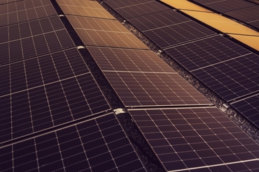 dark moody photo of some large solar panels