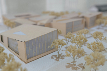miniature model of some buildings with trees