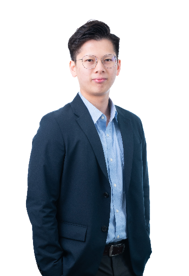 A Picture of Clement smiling in a suit.