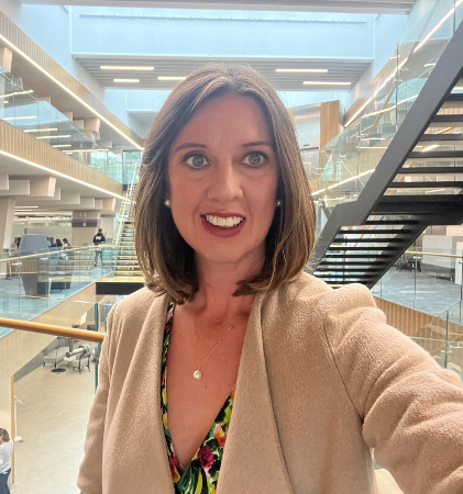 Photo of Charity smiling towards the camera