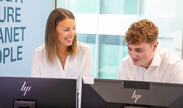 two colleagues talking at work