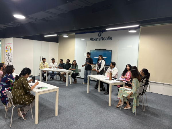 Chinmay with people in a conference