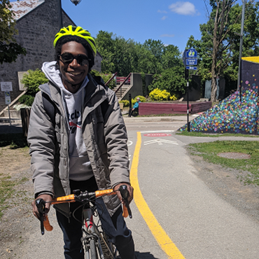 Picture of Jean on a bicycle