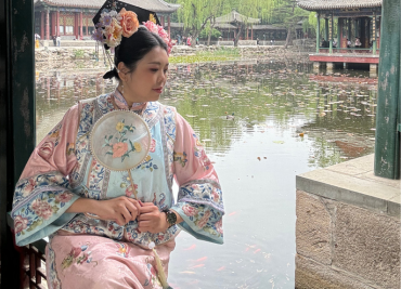 Image of Jessica sitting at the edge of a pond