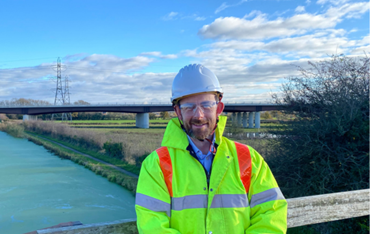 Image of Keith standing on a bridge