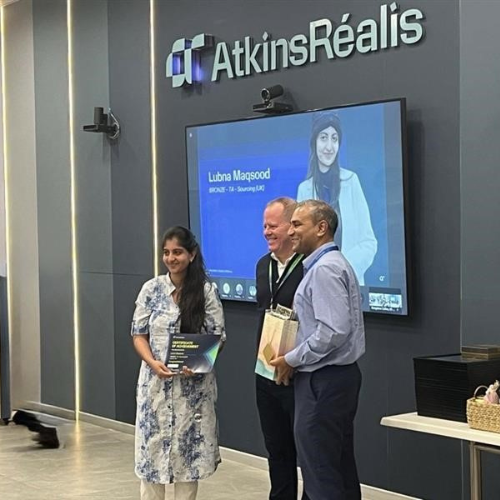 Lubna receiving an award