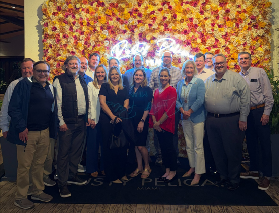 Wendy at a restaurant with her team