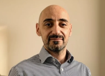 Image of Lorenzo smiling at the camera