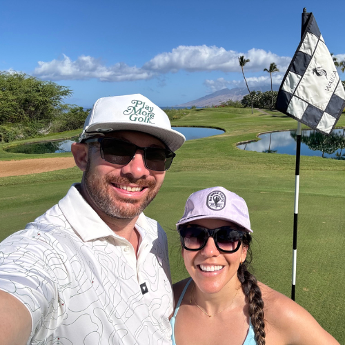 Selfie of Mike and his partner standing in a golf course