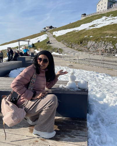 A picture of Niharika posing with a miniature snow man