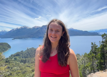 Olivia standing in front of a beautiful scenic place