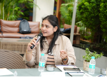 Sameera with a mic at an event