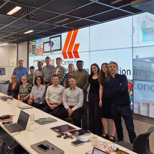 Team photo in a meeting room set up