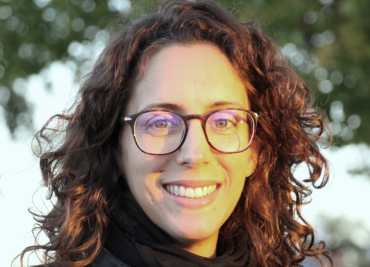 A woman smiling at the camera