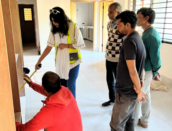Shely with the contractor and staff
