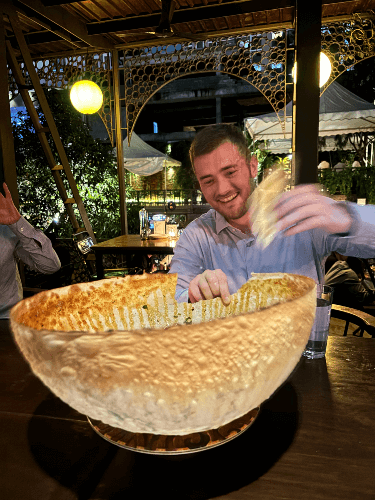 A picture of Ben diving into a delicious crisp dish