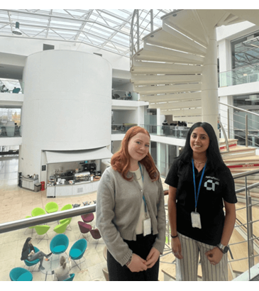 A picture of a colleague and Prisha at office